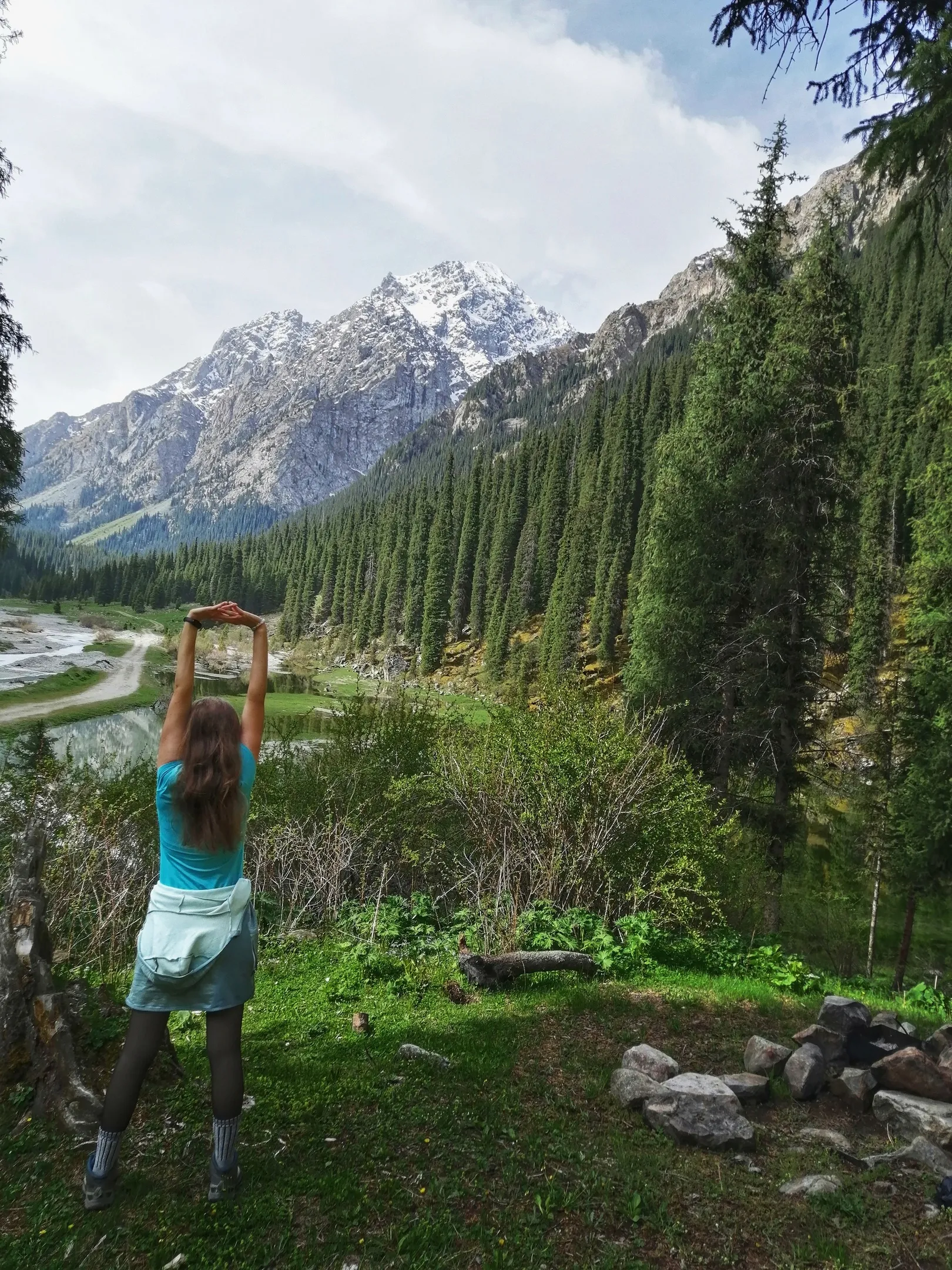 Woman against the backdrop of the nature of the Karakol gorge