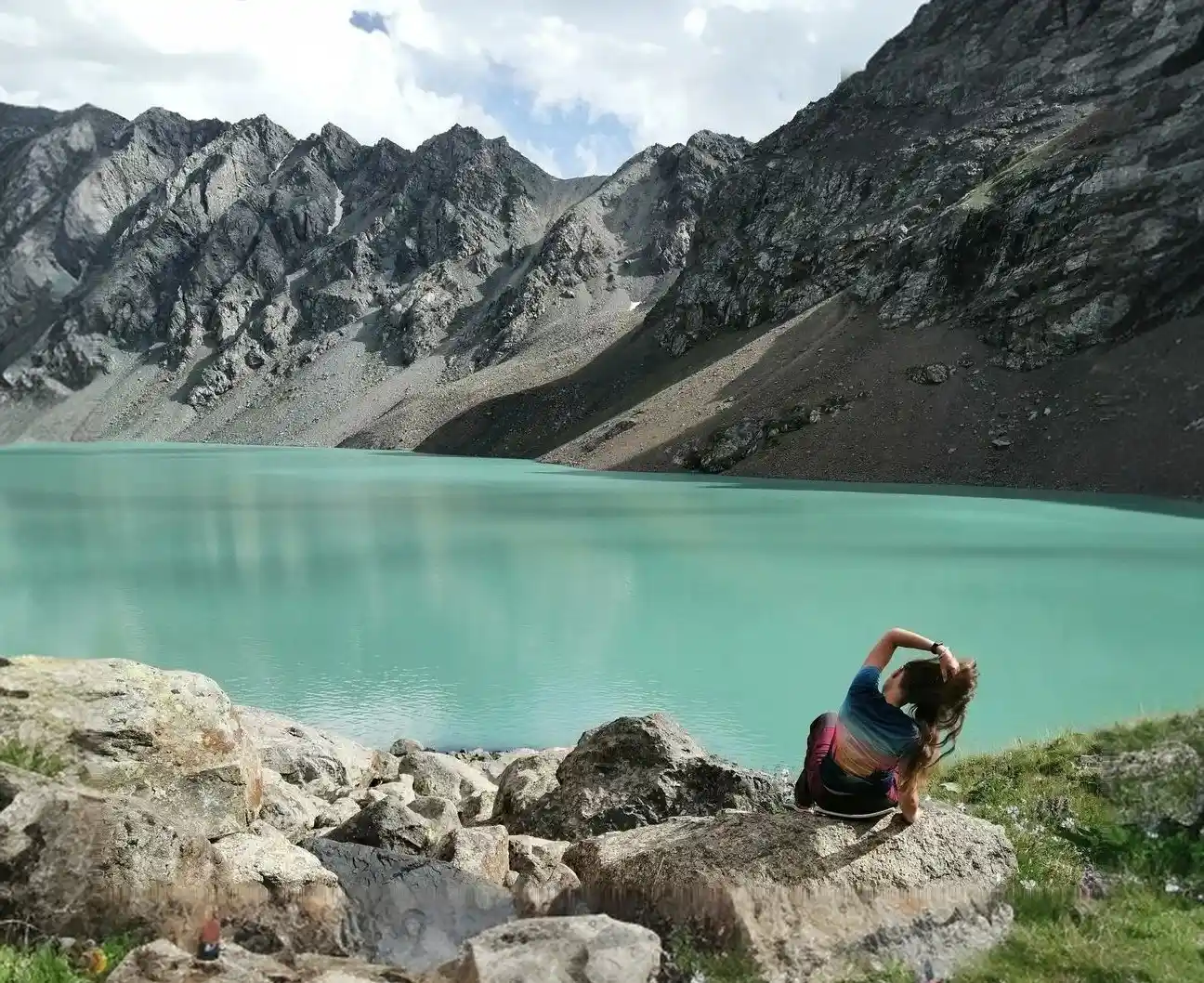 Woman hiking near Ala-Kul lake on Karakol tours