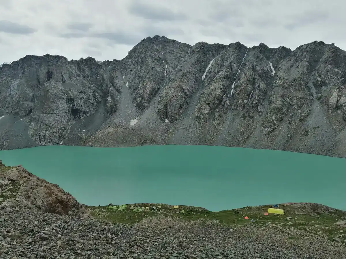 tent camp on the shore of the turquoise lake Ala Kul